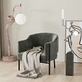 Gray Accent Chair With Throw Blanket In Modern Interior With Floor Lamp Artwork And Plant
