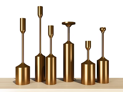 Golden Metal Decorative Ornament Set With Various Heights And Shapes On Wooden Tabletop 3d model