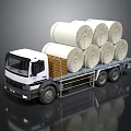 White Flatbed Truck Carrying Multiple Large Paper Rolls On Cargo Bed