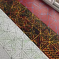 Colorful Geometric Structural Components Featuring Intricate Interlaced Patterns And Lines