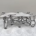 Artistic Wooden Dining Table With Intricate Curved Legs And Unique Structure Design