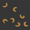 Golden Brown Whole Cashew Nuts on Dark Shiny Surface with Natural Texture