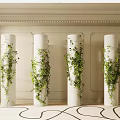 White Column Capitals Adorned With Green Vines In Light Walled Space With Carpet
