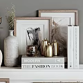 Modern Fashion Books Styled With Framed Artworks Gold Vases And Gray Ceramic Vase