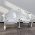 Modern Public Chair With Curved Design Black Leather Seat And Golden Legs On Wooden Floor