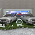Car Exhibition Display Shelves With Wuling Victory Xingchen Ling OS Green Lawn And Plants