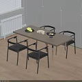Modern Dining Table Set with Black Chairs Light Wood Top Fruit Bowl and Snacks