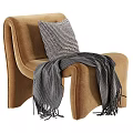 Cozy Modern Upholstered Lounge Chair With Striped Pillow And Knitted Blanket