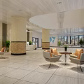 Front Desk Reception Area Modern Lobby With Comfortable Sofas Coffee Table And Green Plants