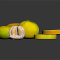 Fresh Whole and Sliced Citrus Fruits Arranged on Black Reflective Surface