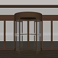 Modern Brass Frame Revolving Door With Glass Panels Surrounding Glass Doors And Wooden Floor