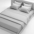 Double Bed With Plaid And Striped Bedspreads And Decorative Pillows In Neutral Tones