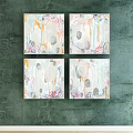 Four Abstract Paintings With Soft Colors Circles And Lines Hanging On Green Wall