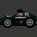 Vintage Green Racing Car Model With Number 63 Driver Black Helmet Goggles And Large Wheels