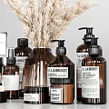 Stylish Modern Bathroom Accessories With Brown Bottles Soap Bar Candle And Decorative Elements