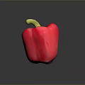 Fresh Ripe Red Bell Pepper with Green Stem on Dark Surface