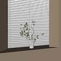 Textured Vase with Flowering Branches and Small Berries on Windowsill by Window Blinds