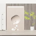 Elegant Wooden Slat Room Divider With Circular Hollow Design Decorative Balls And Green Plant
