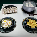 Kitchen Stove With Fried Eggs Corn Kernels Boiled Eggs And Dumplings Cooking 3d model