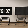 Two Televisions on Wheeled Stands with Shelves Left Screen Showing Time