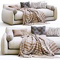 Cozy Modern Living Room Multi Seater Sofa With Striped Blanket And Patterned Pillows