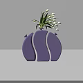 Purple Vase With White Lines Holding White Flowers And Green Leaves On Gray Background