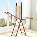 Wooden Foldable Clothes Drying Rack With Pants Drying Rods Near Window Indoor Natural Light