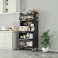 Modern Black Wheeled Kitchen Sideboard With Microwave Dishes Jars And Potted Plant