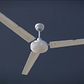 White Three Blades Ceiling Air Conditioner Fan Mounted Against Dark Background