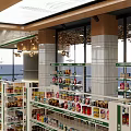 Modern Spacious Supermarket Interior With Shelves Full Of Products Checkout Counter And Bright Lighting
