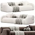Cozy Modern Sectional Sofa In Beige And Brown With Textured Fabric Pillows And Blanket