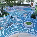 Vibrant Kids Playground With Blue Curved Surface Greenery And Play Structures 3d model
