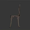 Antique Ornate Metal Chair With Carved Backrest And Intricate Leg Design