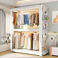 Double Layered Clothes Rack With Various Colored Hanging Clothes And Decorative Accessories