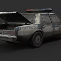 Rear View Of Traffic Division Police Car With Open Trunk And Markings