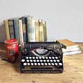 Vintage Ornamental Decor Set with Old Typewriter Books Red Canister and Notebooks on Wooden Tabletop