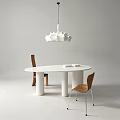 White Round Dining Table With Brown Chairs And White Pendant Light In Modern Minimalist Design