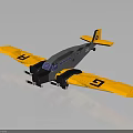 Detailed Model Airplane With Yellow Wings Gray Body And Black G Letters On Wings