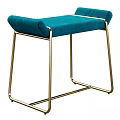 Modern Upholstered Stool With Light Gray Fabric Gold Metal Legs And Gray Blanket Draped