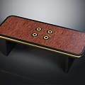 Stylish Table With Red Wooden Surface Gold Trim Four Gold Circular Accents And Black Legs
