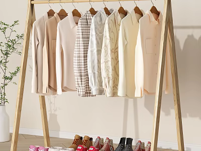 Wooden Clothes Rack Displaying Various Hanging Clothes and Shoes Below with Decorative Plant 3d model
