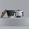 Black and White Ceramic Cups With Wooden Lids Handles On White Circular Display Stand