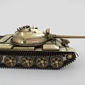 Military Tank with Long Cannon Visible Tracks and Weathered Beige Exterior