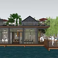 Sunroom Over Water Featuring Wooden Deck Surrounded By Trees With Tables Chairs And People Relaxing