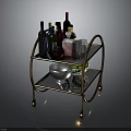 Brass Bar Cart With Wine Bottles Shakers And Glasses On Metal Shelves