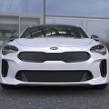 Sleek White Kia Sedan With Sporty Design Black Roof And Black Wheels