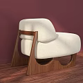 Cream Fabric Single Sofa With Unique Wooden Legs Curved Design And Pink Wall Wooden Floor