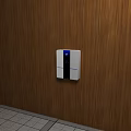 White Wall Mounted Industrial Control Device With Blue Display Screen On Wooden Wall
