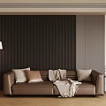 Two Seater Brown Leather Sofa With Pillows Throw Blanket Near Dark Striped Wall Floor Lamp