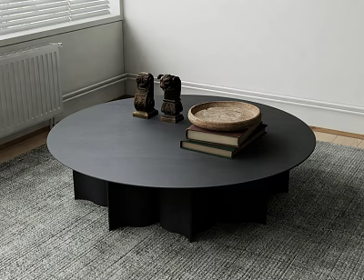 Round Black Coffee Table On Gray Rug With Small Sculptures Wooden Tray And Stacked Books 3d model